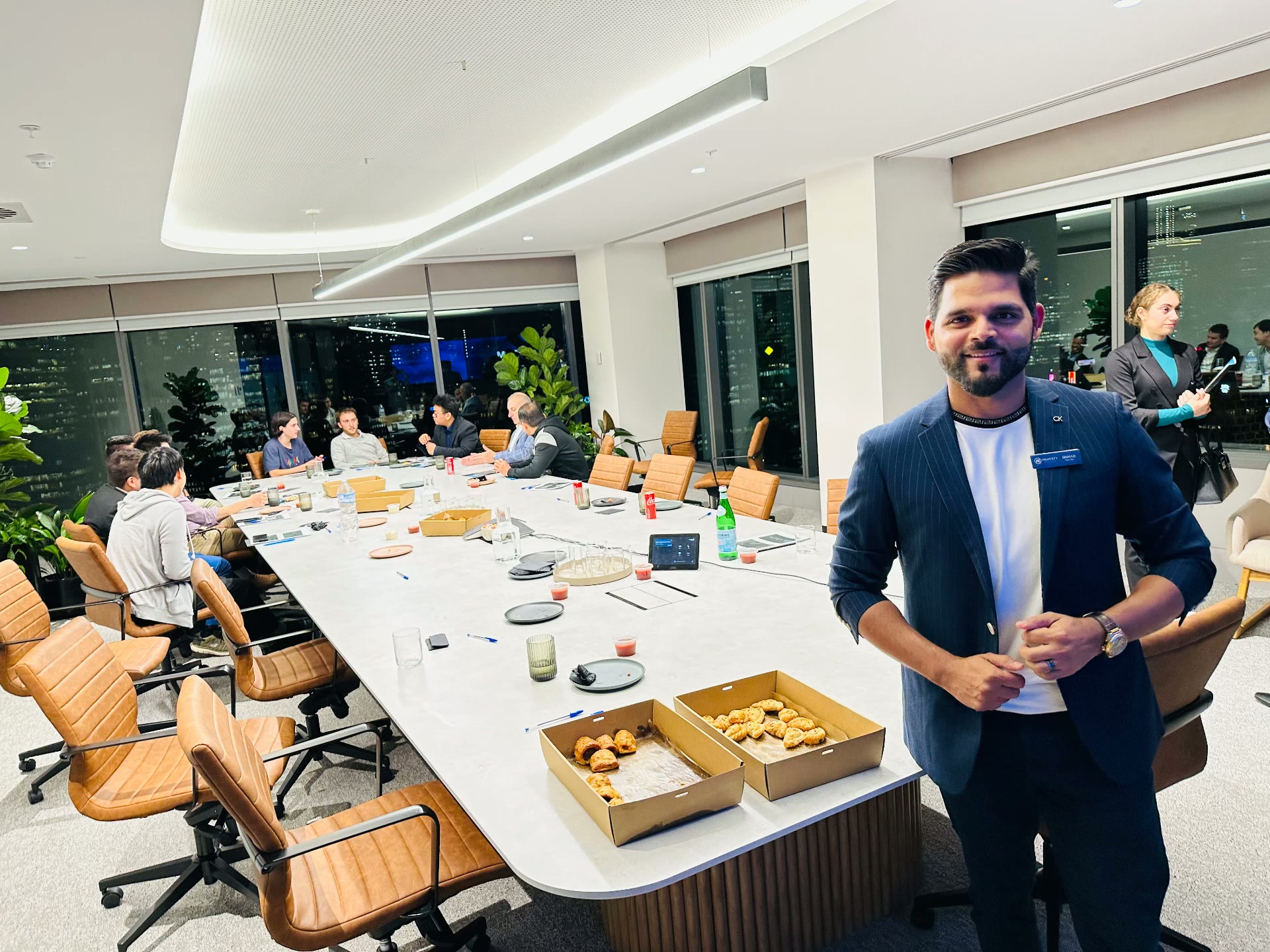 Irshad hosting an investor evening in a Melbourne boardroom